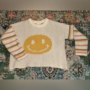 Smiley face striped sweater